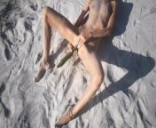 Amateur nudist teen fucks her tight pussy with a huge cucumber on a public beach. Ends with a pee. from peepvoyeur