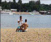 Milf Lilly naked on public beach got oil massage from stranger from nakedtoll
